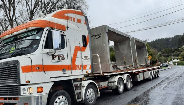 Truck delivering precast culvert